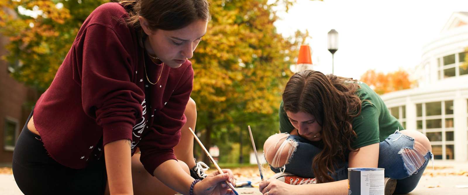 Students creating sustainability mural