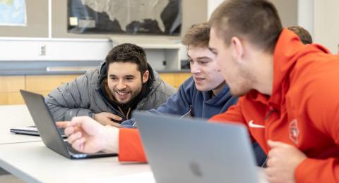Three male students in class