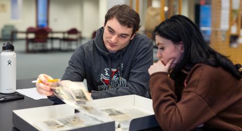 Students studying archive materials