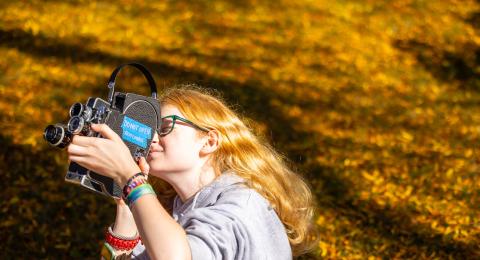 Keene State Student using film camera